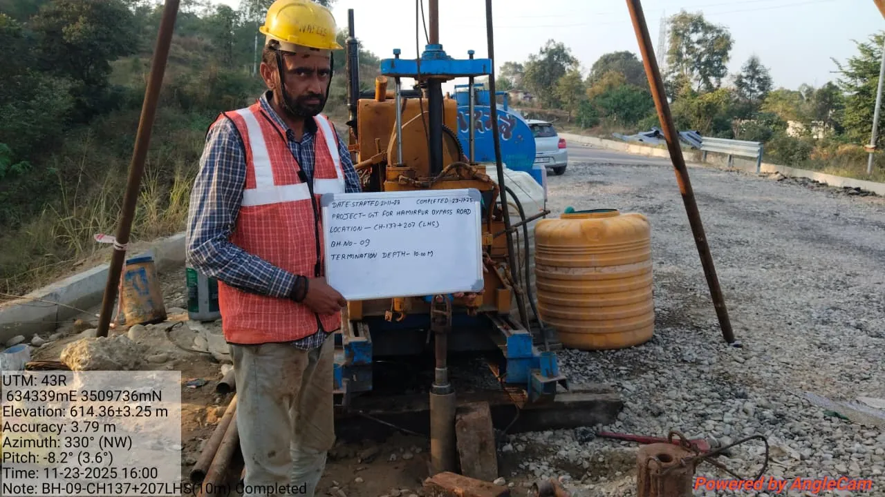 Drilling rig on site with borehole marker board