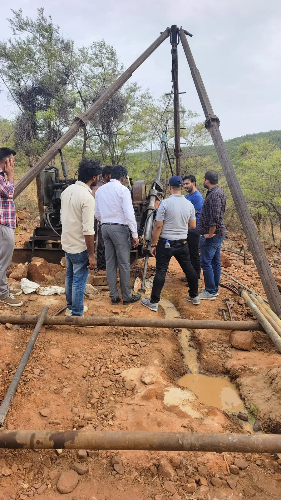 Engineers reviewing a drilling operation
